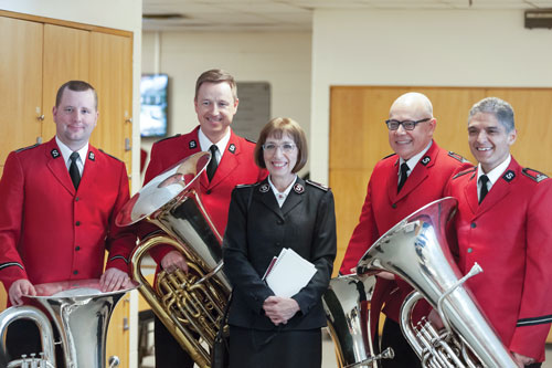 Commissioner Susan McMillan with members of the Canadian Staff Band