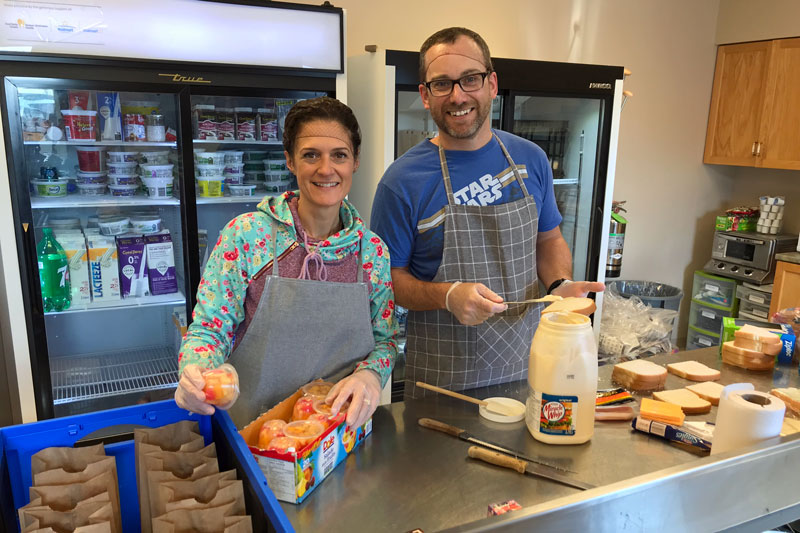 Volunteers make lunches for the Army's food program