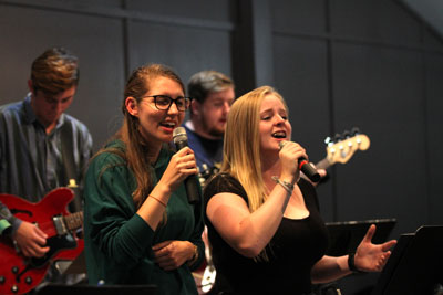 Robyn Purcell (Montreal Citadel) and Julianna Gerard (Oshawa Temple, Ont.) sing with the Worship Team elective