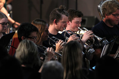 A group of young people playing cornet