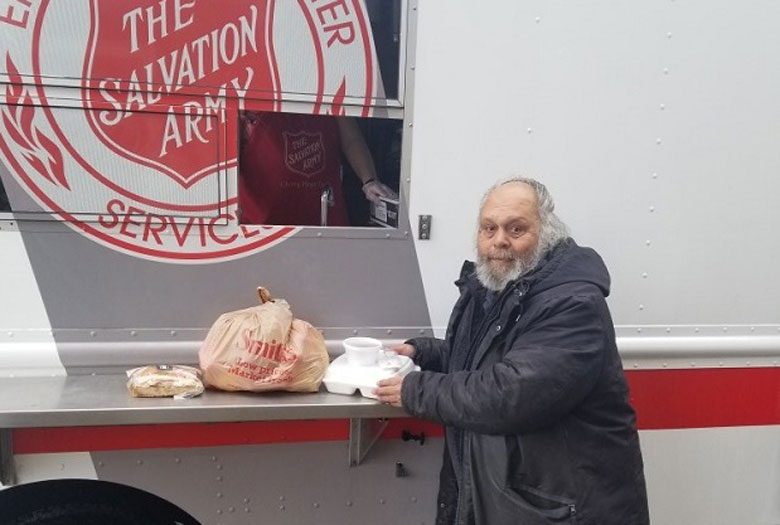 A visitor grabs lunch from an emergency response unit in Williams Lake, British Columbia