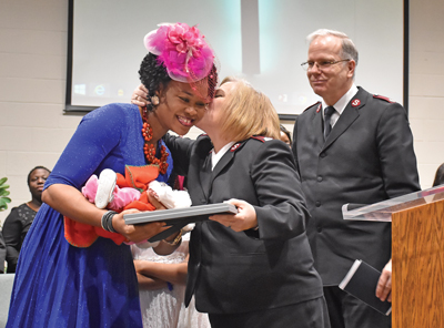  Helen and Mjr Donna Senter share a moment after the dedication of Helen’s child at York CC