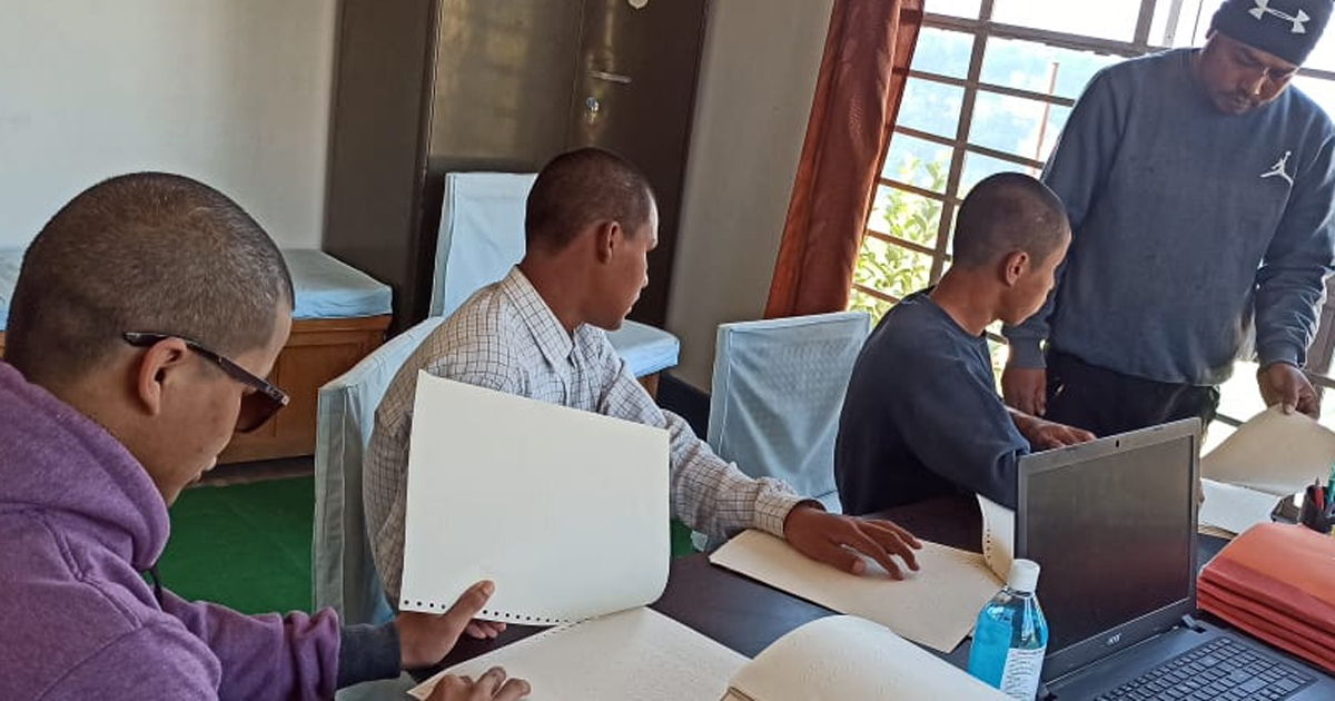 Blind students reading Braille textbooks in Kalimpong, India