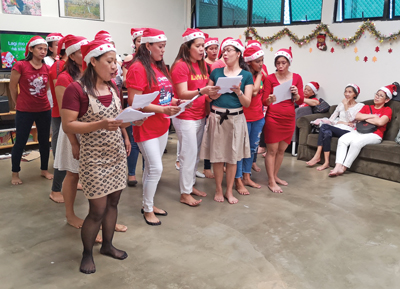 Members of William Booth Corps lead a Christmas program at Carehaven, a shelter for domestic helpers