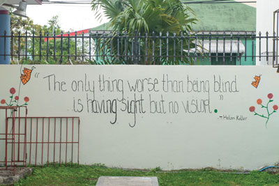 The wall of The Salvation Army Erin H. Gilmour School for the Blind and Visually Impaired with a quote from Helen Keller
