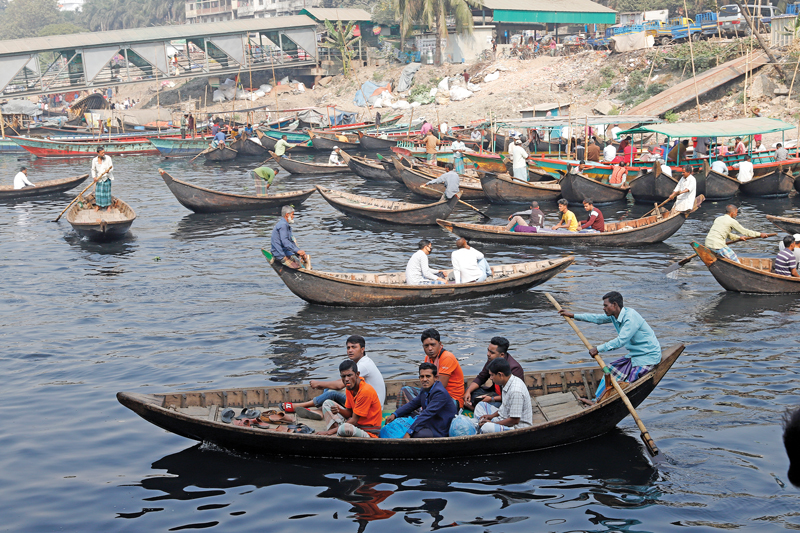 Traditional wooden boats are an important means of transportation in Bangladesh