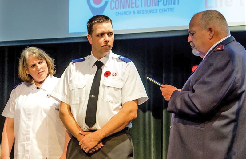 Andrew and Jessica Downie listen to Mjr Les Burrows during their soldier enrolment