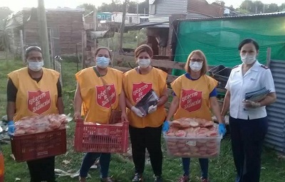 Salvation Army personnel distribute food parcels in Uruguay