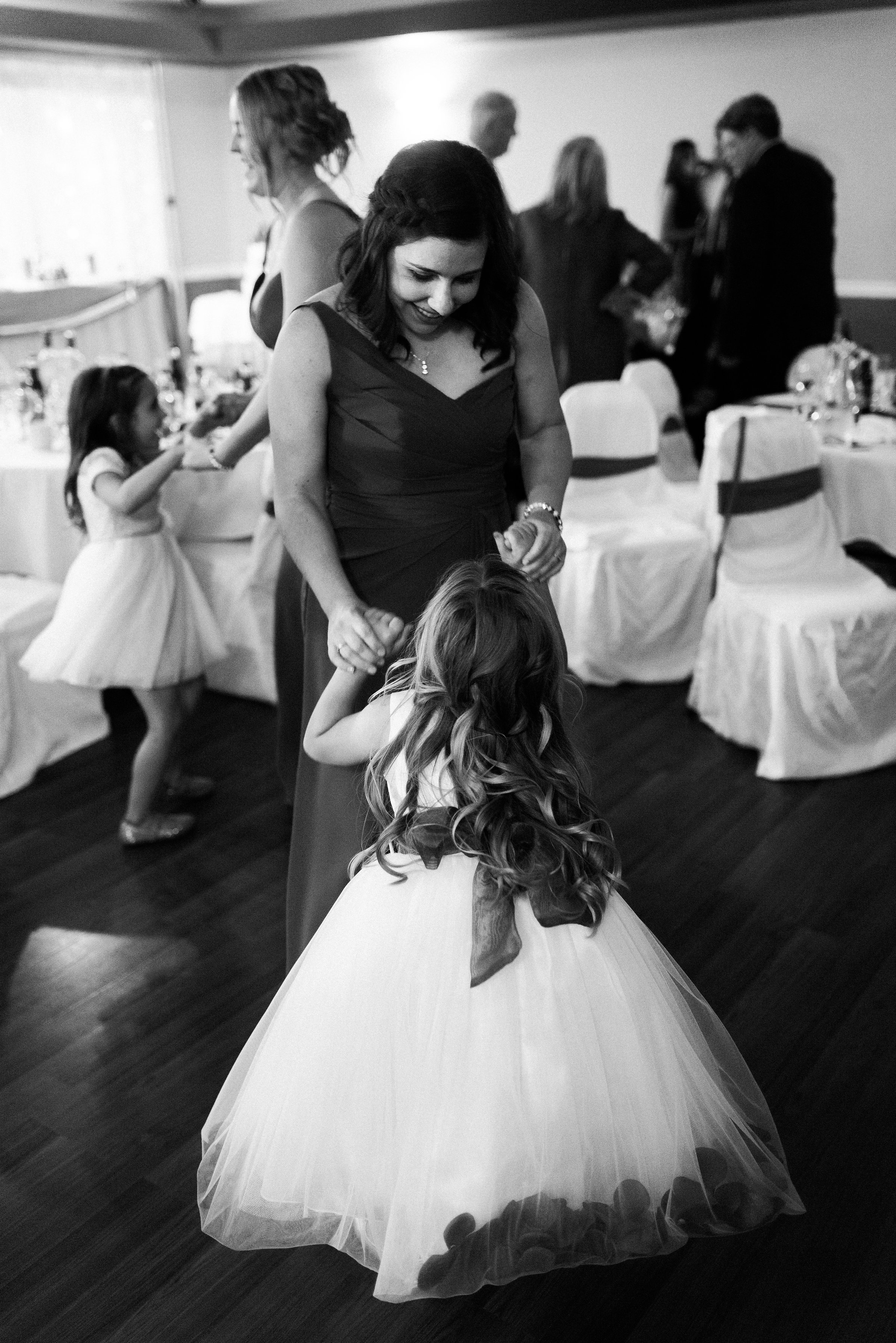 Captain Laura Van Schaick holds her daughters hands, dancing