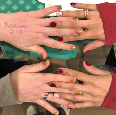 Photo of interlaced women's hands