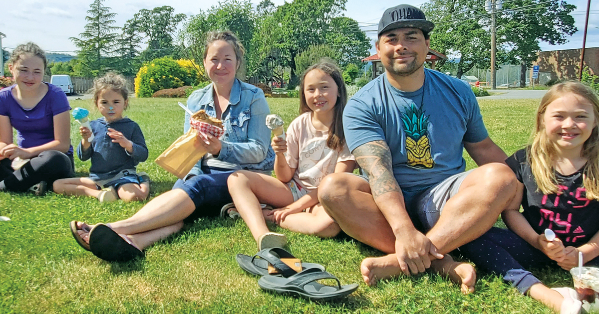 Sipili Molia with his wife, Krista, and children