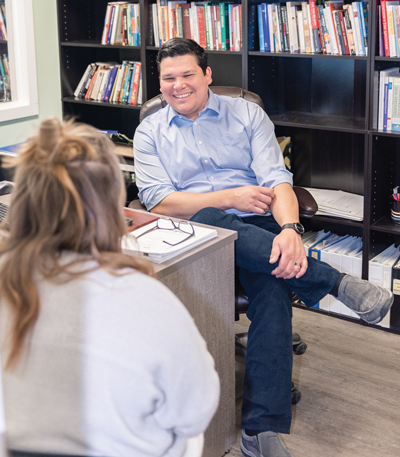 Photo of Cameron Eggie in his office