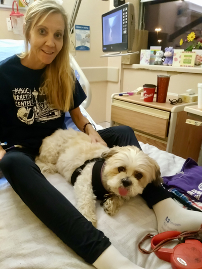 Cindy gets a visit from her therapy dog, Spencer, at North York General Hosptal