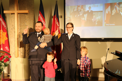 Cadets Brian and Natalie Williams with their children