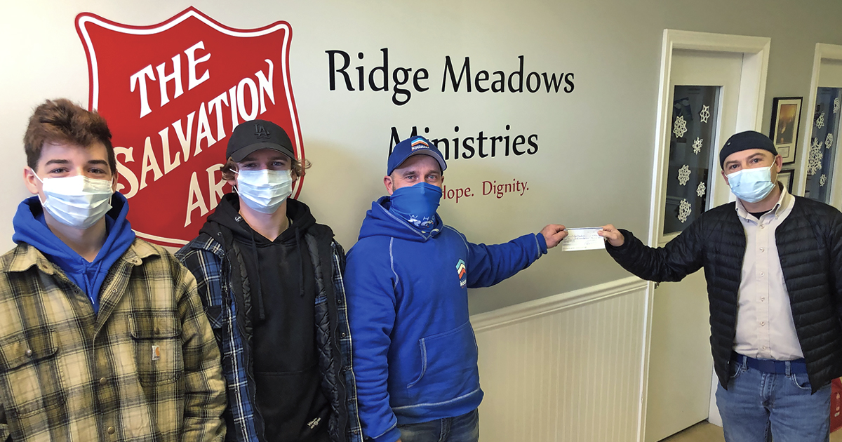 Mark Stewart (right) of Ridge Meadows Ministries receives a cheque from Clay Gagnon (2nd from right)