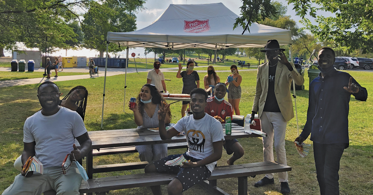 Participants in Barrhaven Church’s PhotoVoice program enjoy a wrap-up pizza party