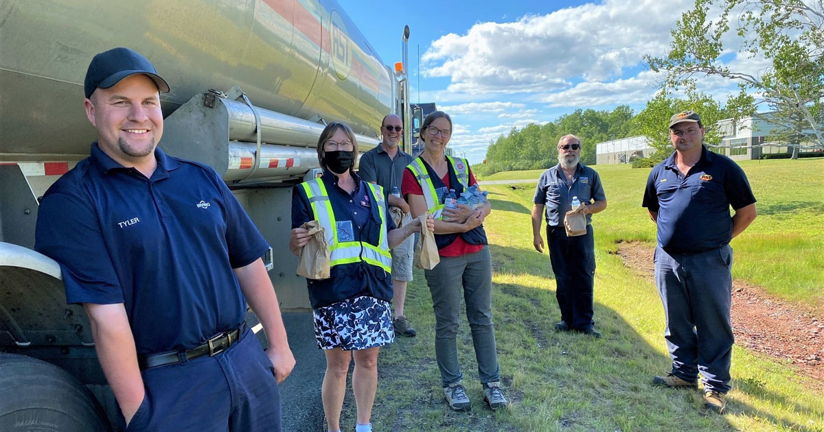 Volunteers hand out lunch bags to truckers at the New Brunswick-Nova Scotia border