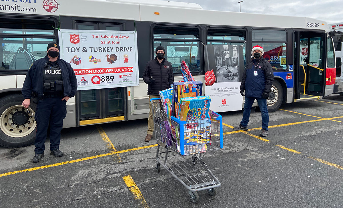 The EDS team in Saint John, N.B., holds a toy and turkey drive in a Walmart parking