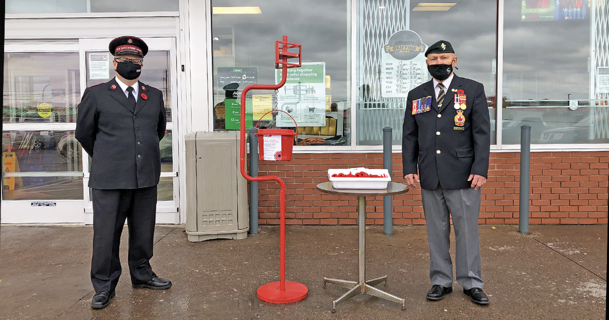 Salvation Army Major Daniel Roode and Mike Murdock of the Royal Canadian Legion at their post