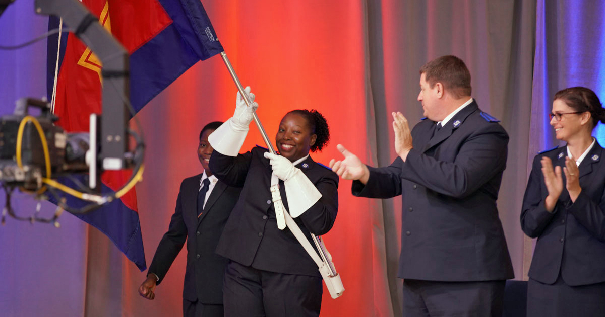 Cadet Krishna McFarlane carries the sessional flag (Photos: Symon Ptashnick)