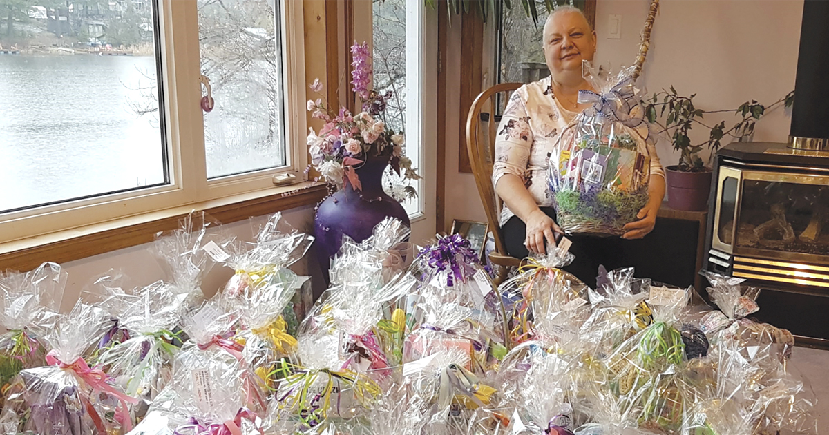 Linda Pearce with just some of the more than 6,015 baskets she has made over the past seven years. 