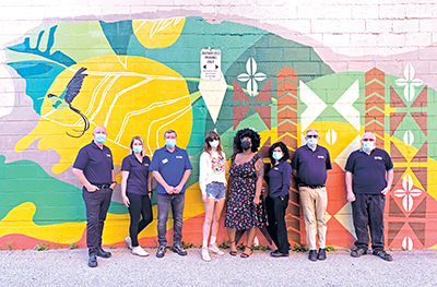 NRO staff and the artists are pictured with the mural