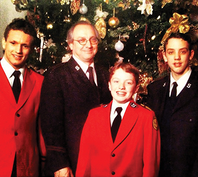 Marcus Venables, age 12, with his family, in Salvation Army uniforms