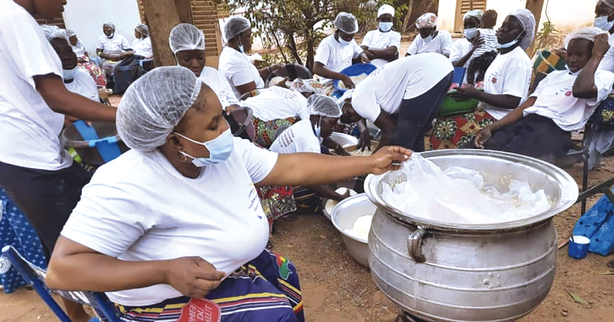 the home league members are taught how to cook attieke, a local meal enjoyed in West Africa