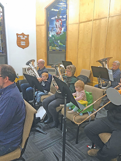 Photo of Holloway's parents, Lloyd and Jeanette Hillier, keeping an eye on Luke and Jessica while the band rehearses