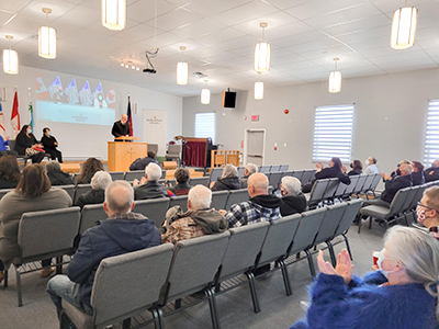 People gather to hear Major Rene Loveless speak