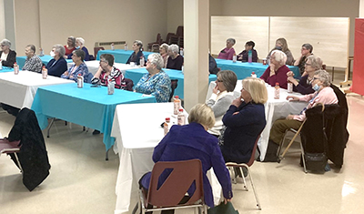 Women gather at Corner Brook Temple, N.L., for a live viewing of The Well