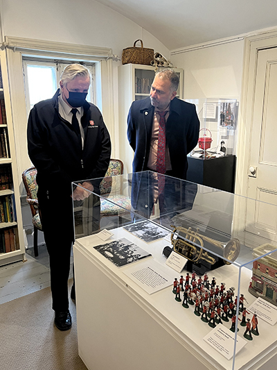 Tom Mrakas (right), mayor of Aurora, Ont., visits the Hillary House exhibit, where he shares a moment with Mjr Ron Millar, director of archives