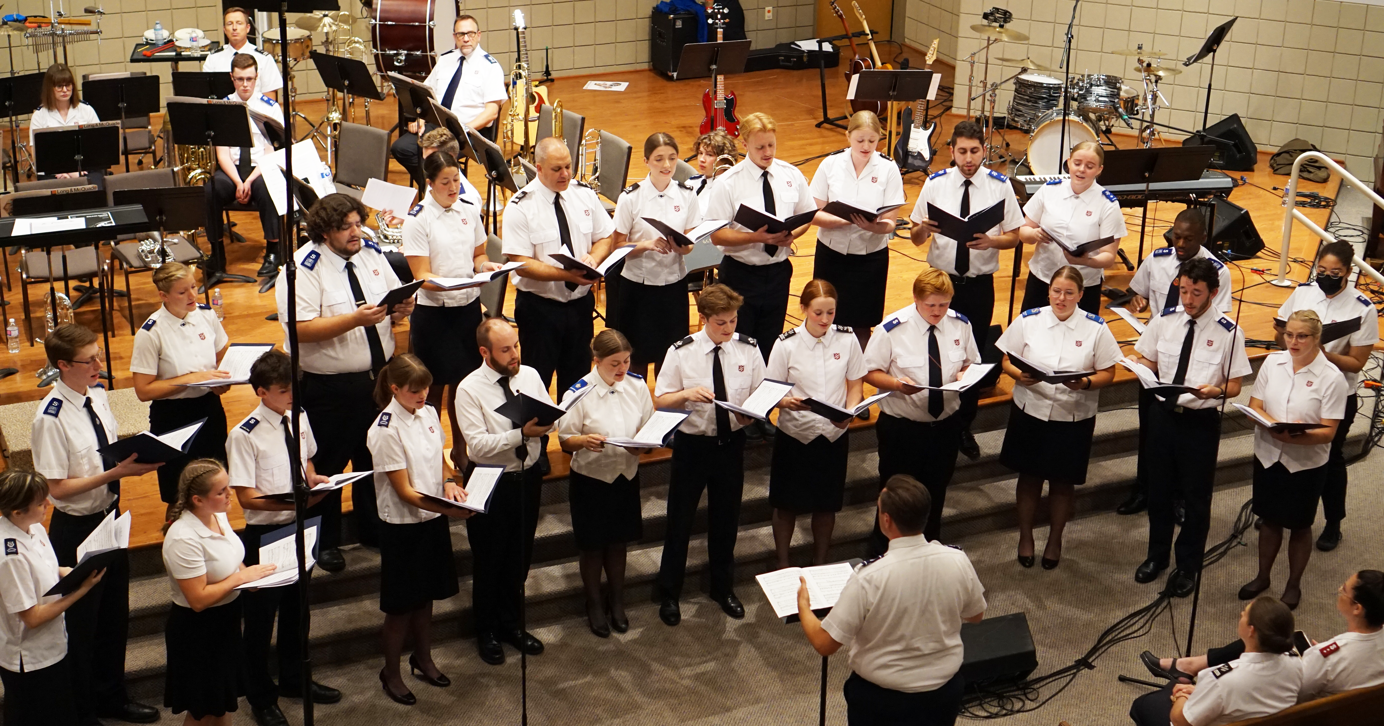 “A” chorus, led by special musical guest Matt Woods, sings during the final festival