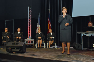 A woman singing on a platform