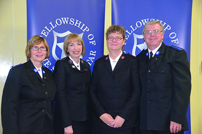 Then Lt Donna Downey shares a moment with her brother and spiritual mentor, Ivan Downey, and, from left, sister-in-law, Louise Downey, and Comr Susan McMillan, then territorial commander, at the Fellowship of the Silver Star luncheon that took place following her commissioning as an officer in 2015 