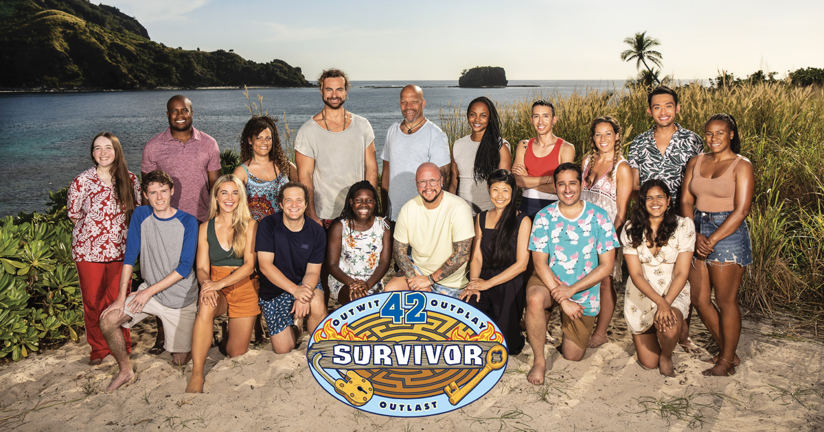 The cast of Survivor together on a beach