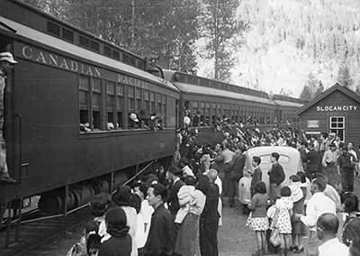 People gather to board a train