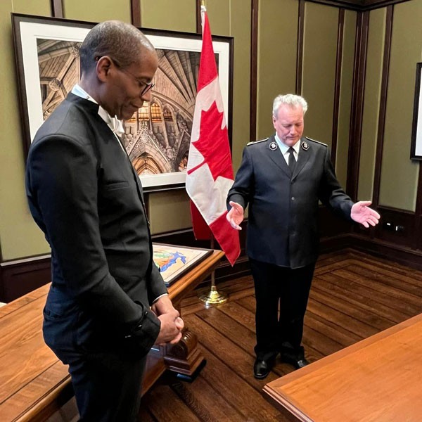 Two men pray together