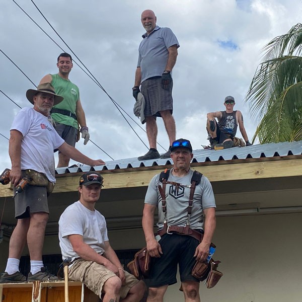 A group of men working on a roof