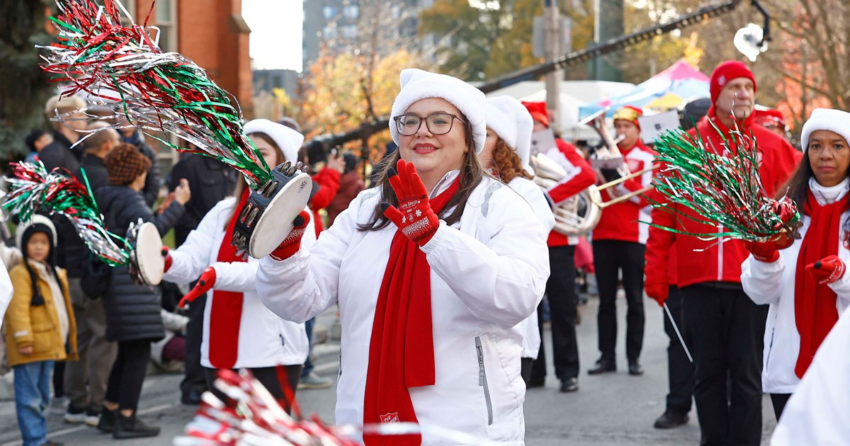 A group of Salvationists march in a Santa Claus parade