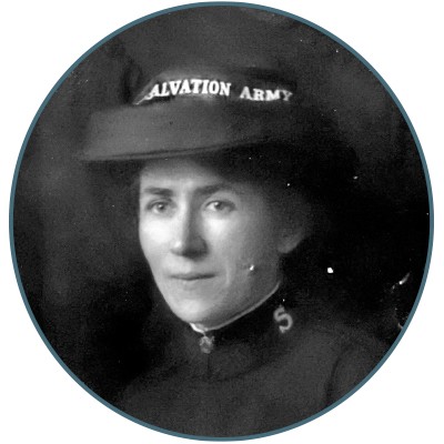 A woman wearing a coal scuttle bonnet