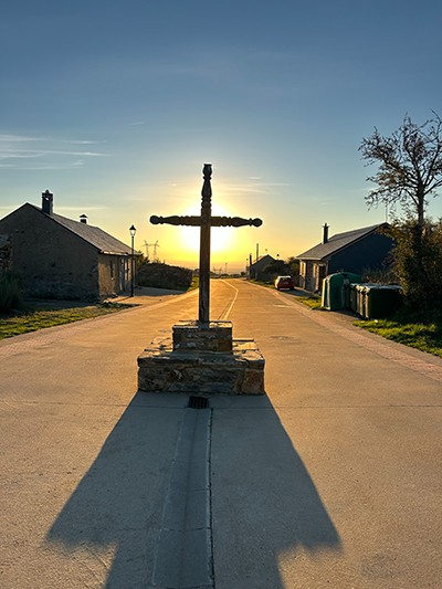 A cross in the middle of a road