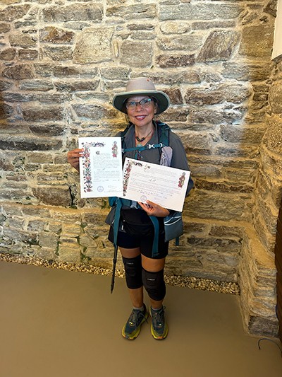 Sally Hill holds a certificate