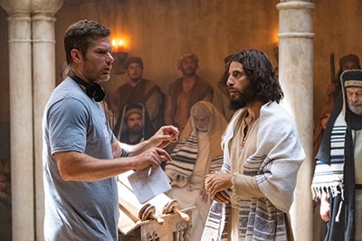 Jonathan Roumie, in character as Jesus, talks with Dallas Jenkins on the set of The Chosen