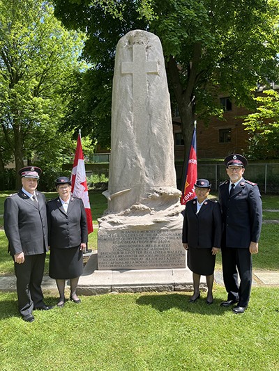 From left, Commissioners Lee and Debbie Graves and Colonels Lani and John Chamness stand in front of the Empress of Ireland monument in Mount Pleasant Cemetery