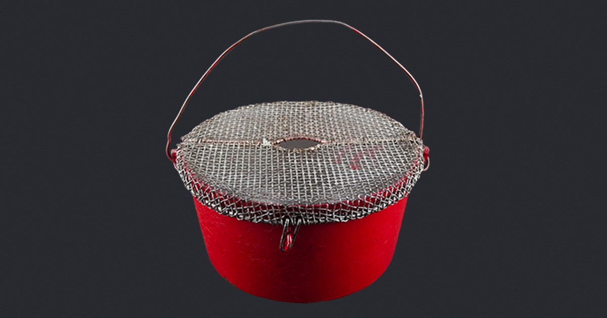 An old Salvation Army kettle with a metal mesh top