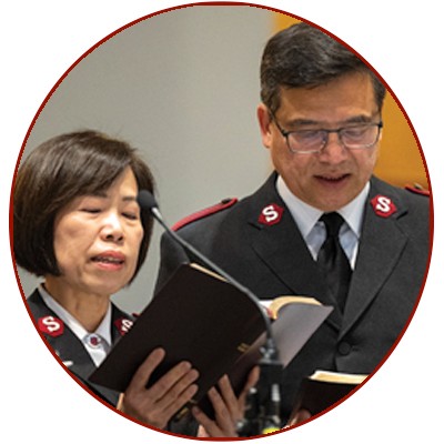 Aux-Cpts Florence and Steve Yau read from the Bible