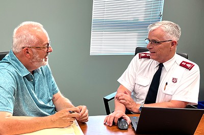 Lt-Col Morris discusses Natural Church Development with Chuck McDougall, church health committee chair