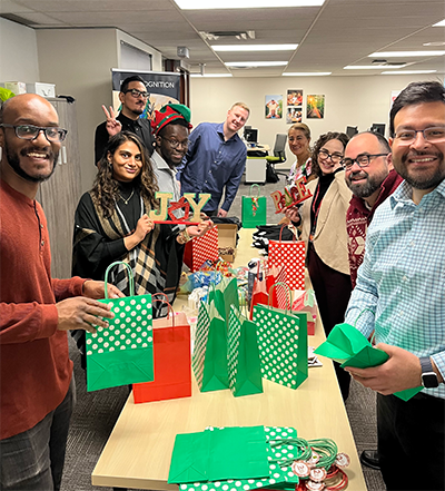 People putting gift bags together.