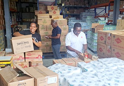 People in a warehouse of supplies